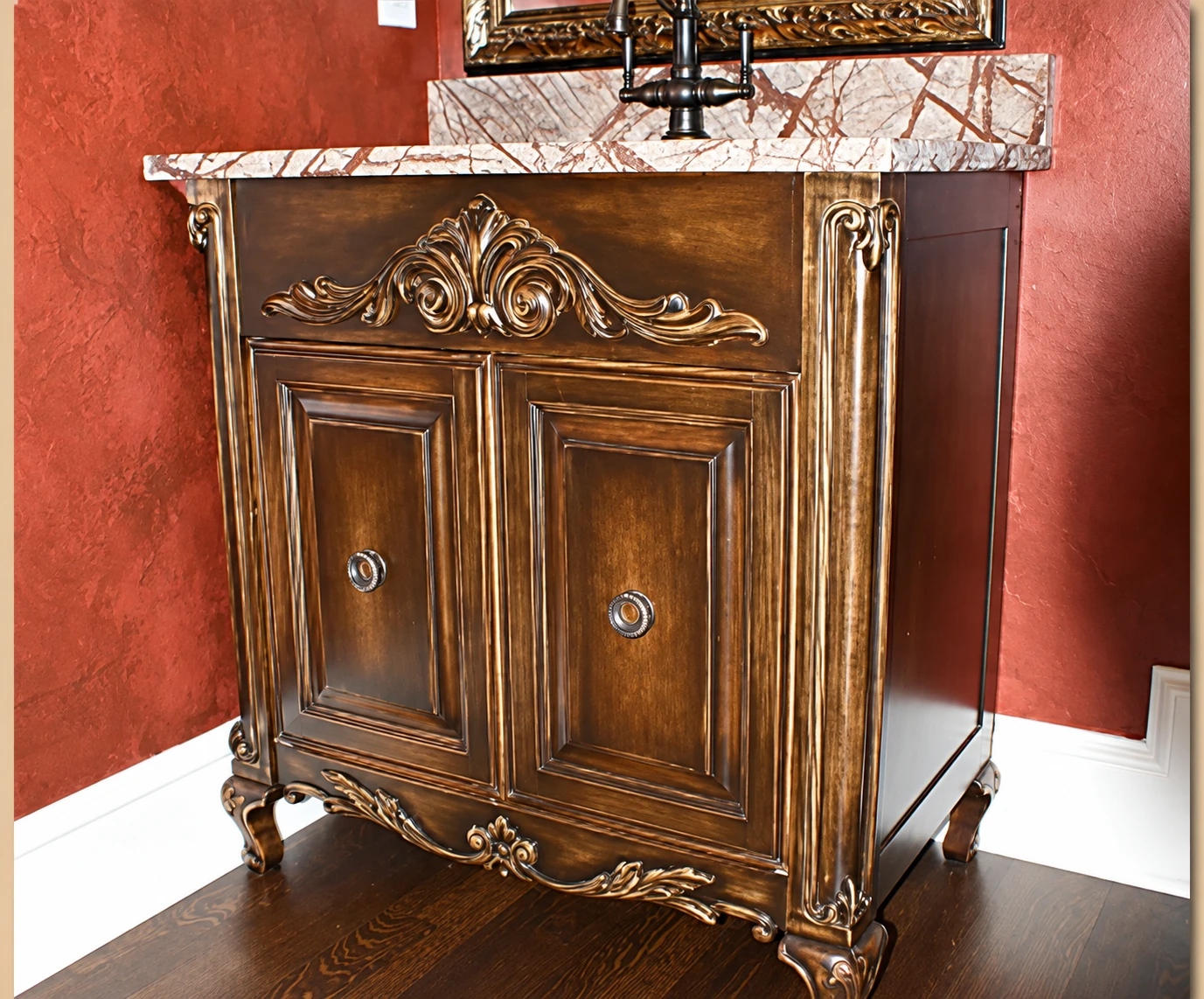 Ornamental freestanding wood cabinet with carved details
